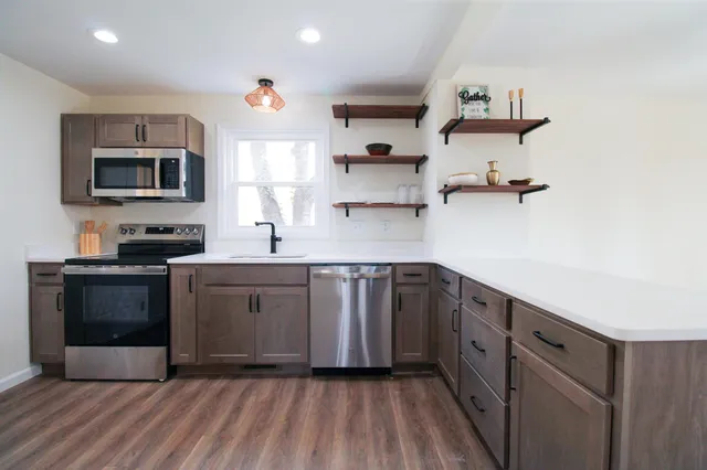a view of a bathroom with wooden floor