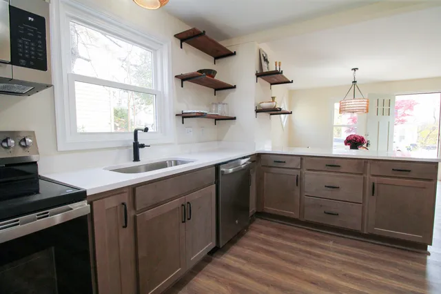 a bathroom with a sink toilet and a mirror