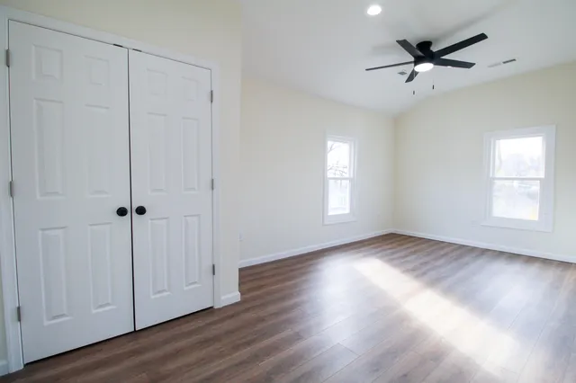 a white toilet sitting next to a bath tub