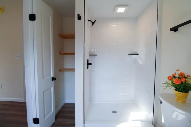 a view of a house with a snow in the yard