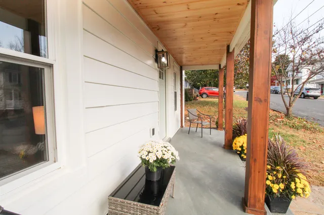 a view of a balcony with furniture