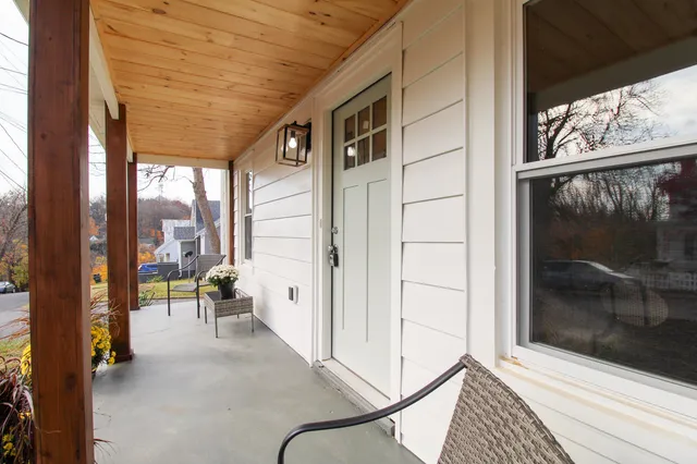 a living room with furniture and flowers