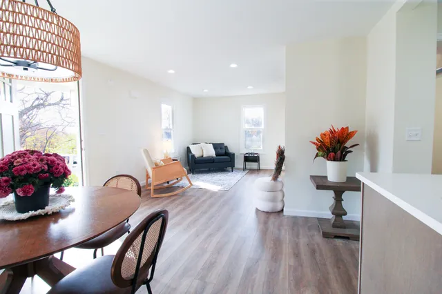a view of a dining room with furniture and wooden floor
