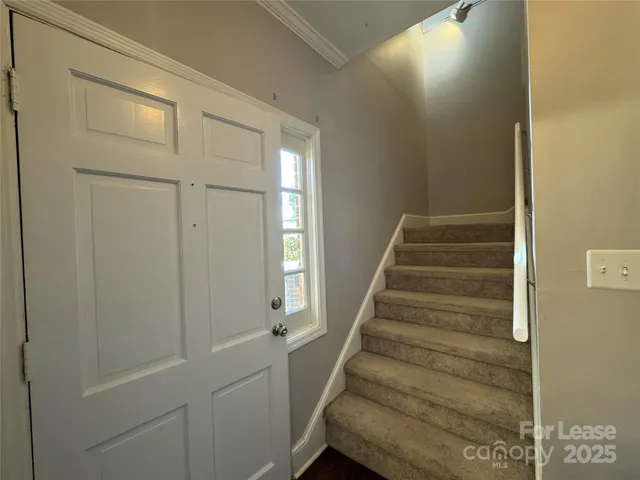 a view of entryway with wooden floor