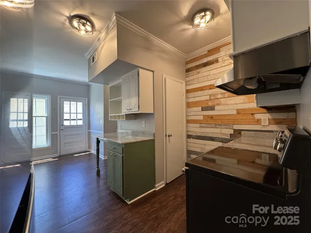a kitchen with a refrigerator and a sink