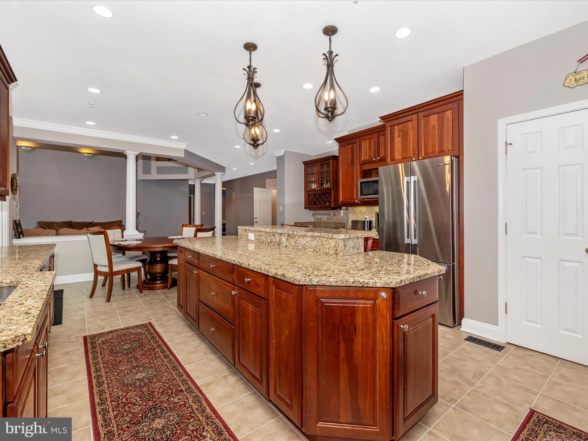 352 Ridge Road Washington Grove, MD 20880 - Photo 14 of 58 a kitchen with stainless steel appliances granite countertop a sink dishwasher and a refrigerator with wooden floor