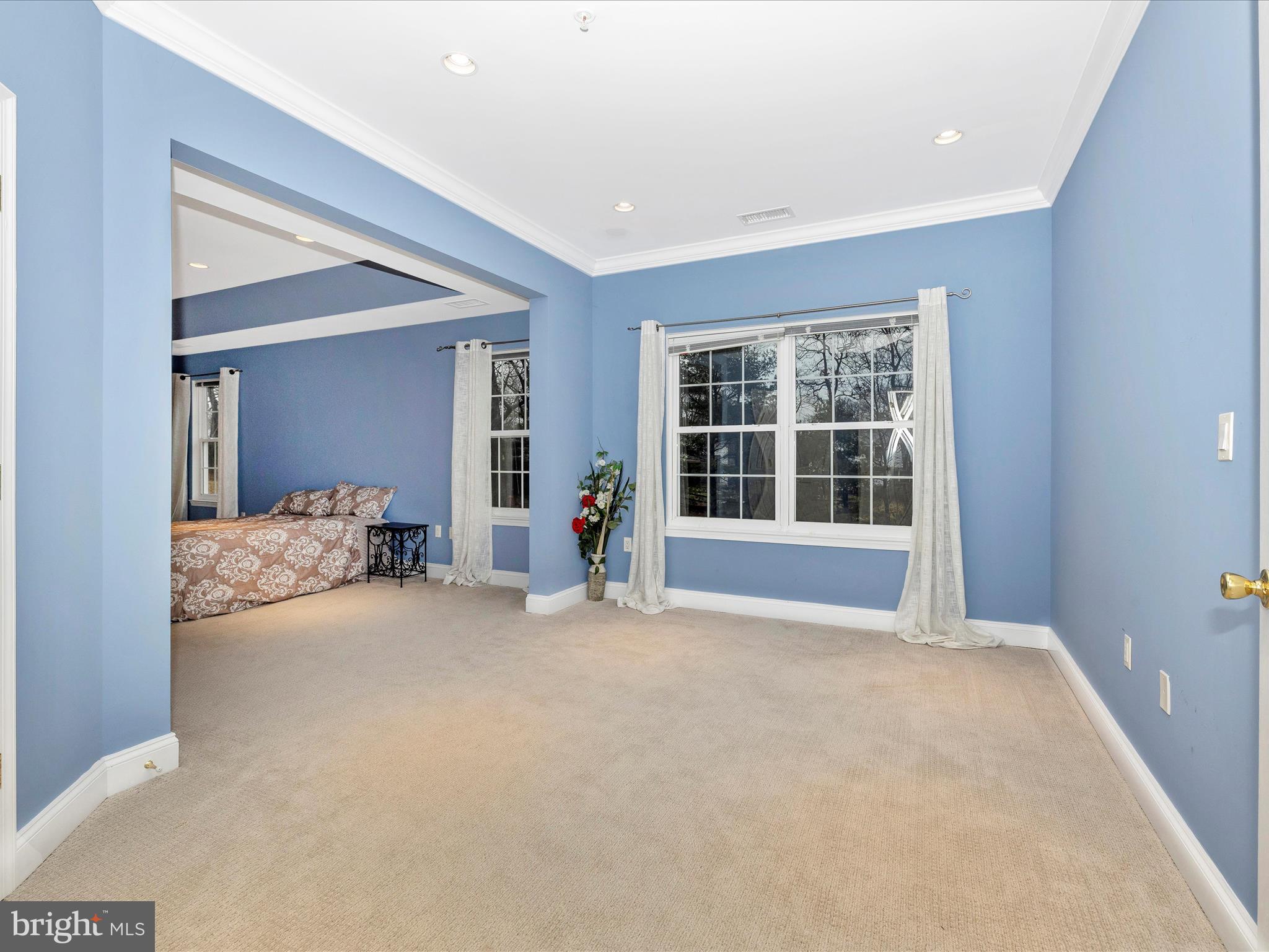 352 Ridge Road Washington Grove, MD 20880 - Photo 24 of 58 a view of a big room with windows and a chandelier