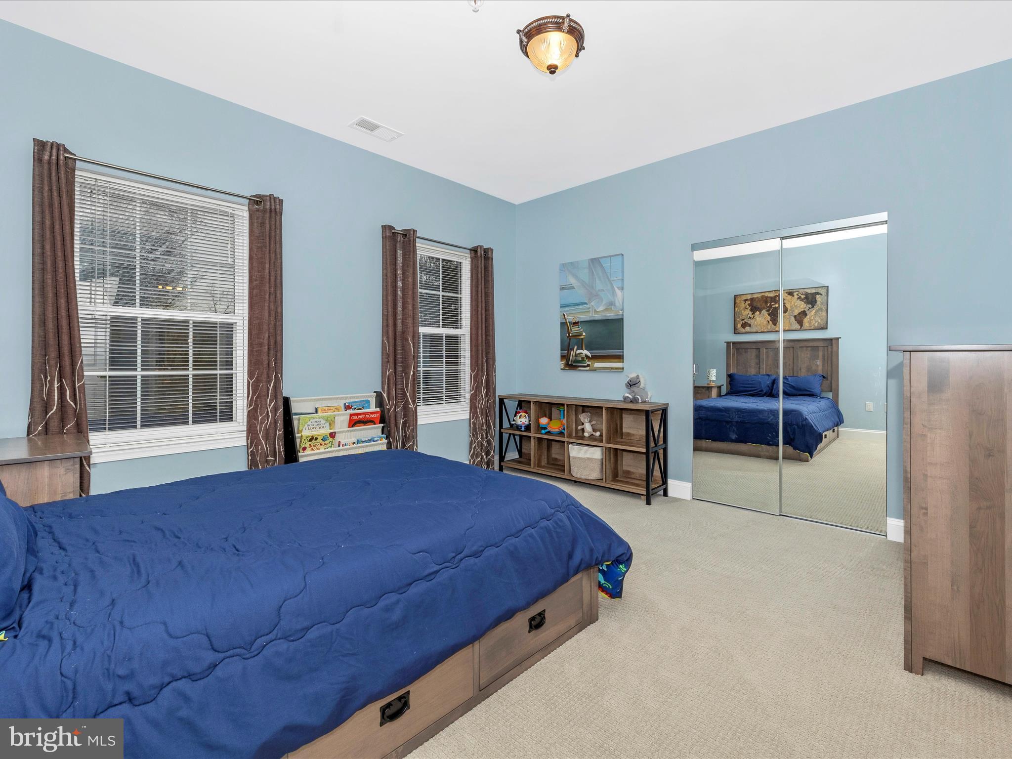 352 Ridge Road Washington Grove, MD 20880 - Photo 29 of 58 a bedroom with a bed and a cabinets