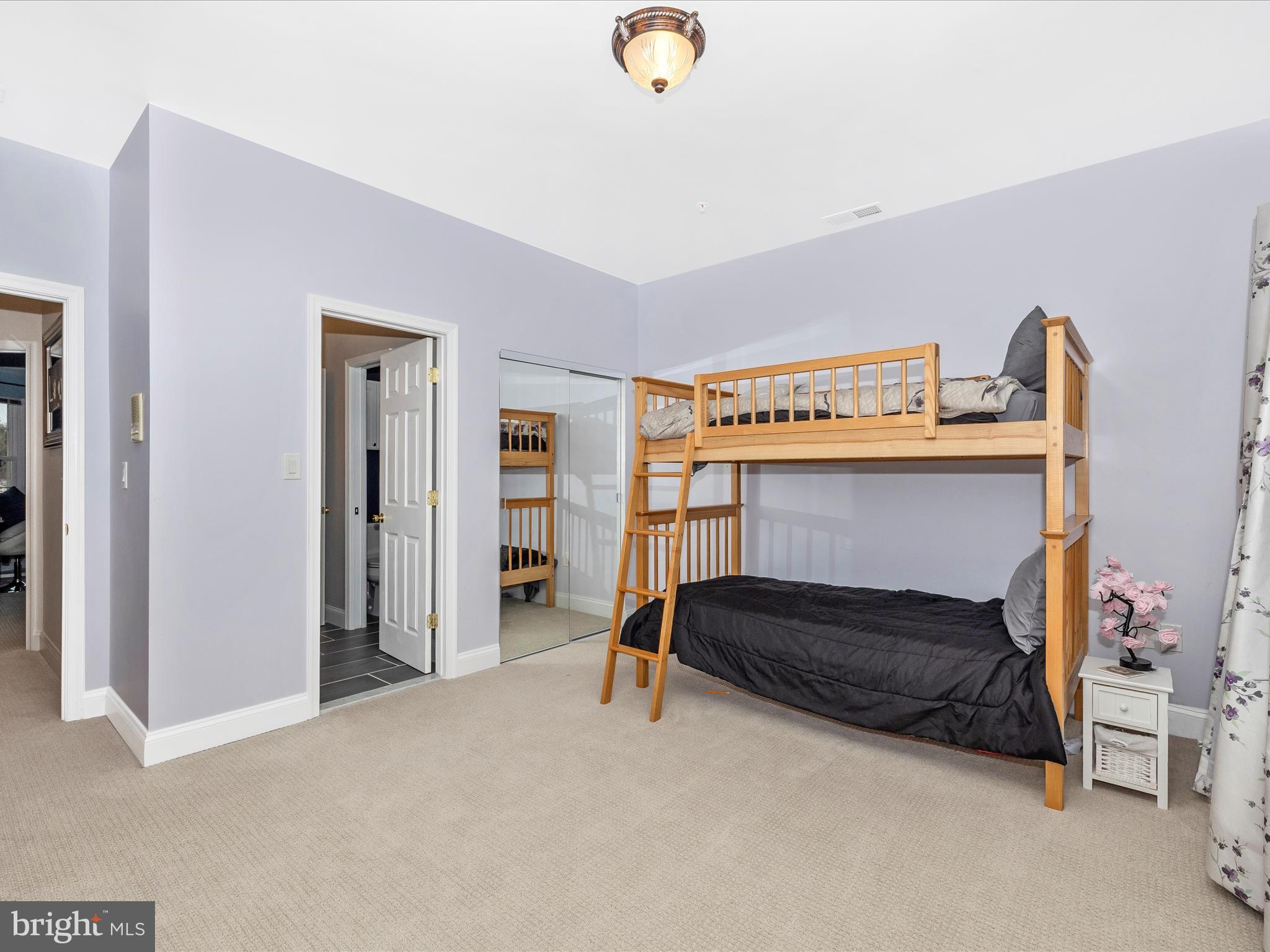 352 Ridge Road Washington Grove, MD 20880 - Photo 33 of 58 a bedroom with a bed and a chandelier