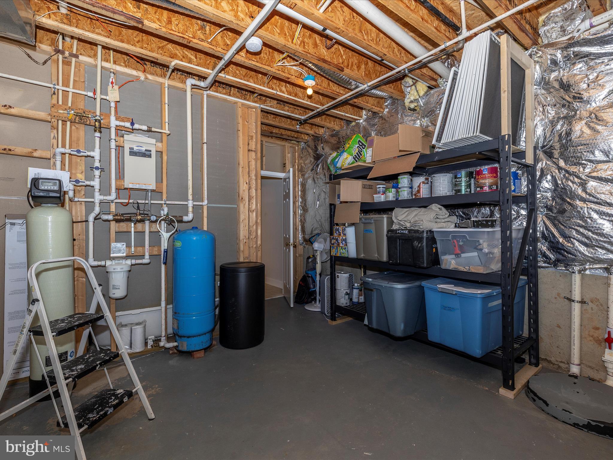 352 Ridge Road Washington Grove, MD 20880 - Photo 45 of 58 a view of a storage room with washer and dryer