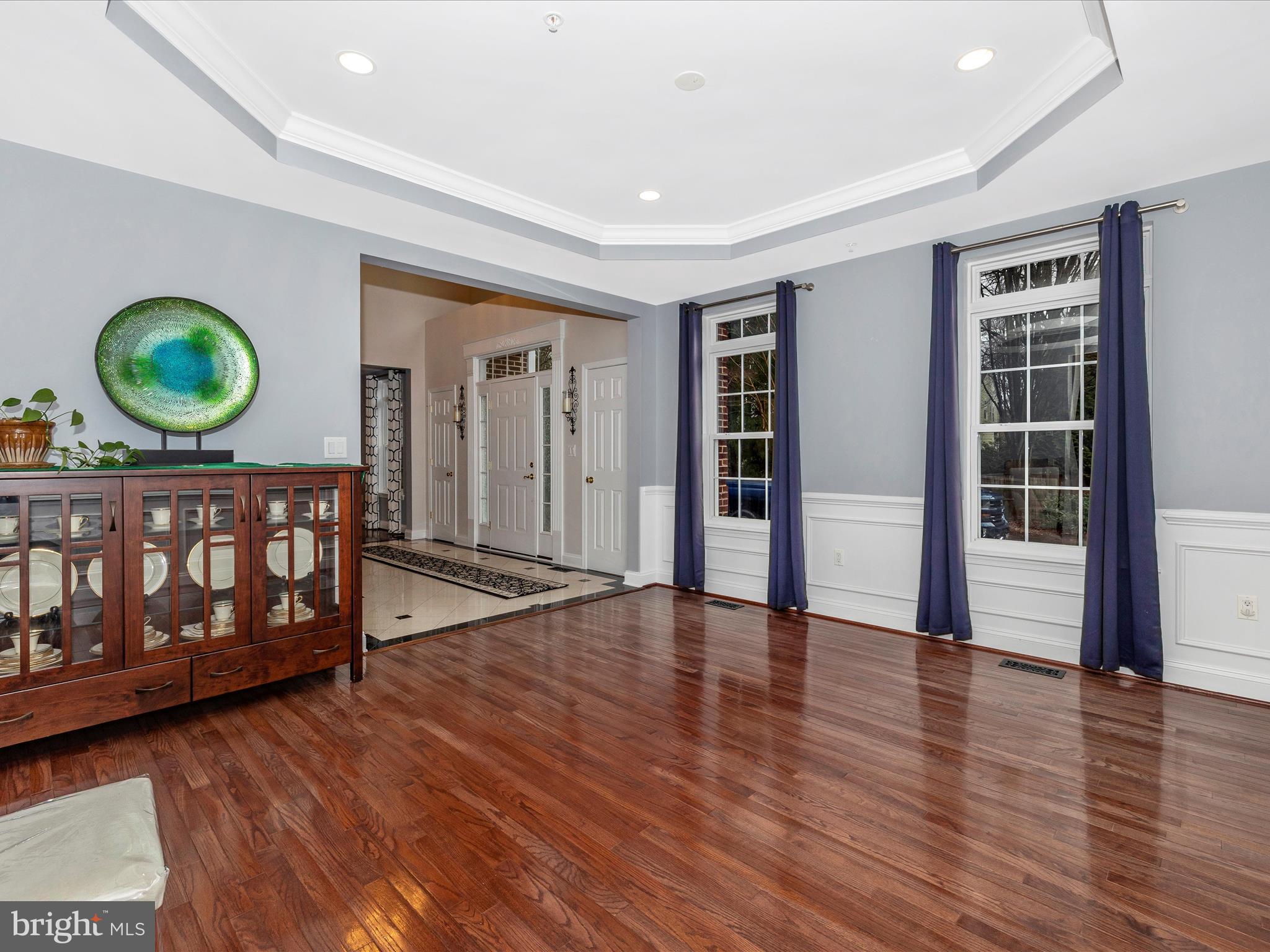 352 Ridge Road Washington Grove, MD 20880 - Photo 9 of 58 a view of an empty room with wooden floor and window
