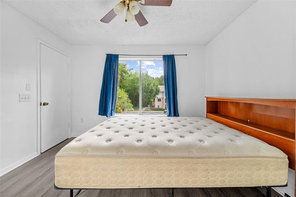 3921 Southwest 34th Street, Unit 208 Gainesville, FL 32608 - Photo 20 of 33 a bedroom with a bed and window