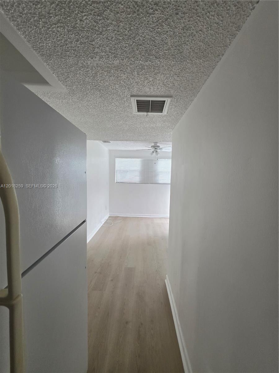 4601 Southwest 5th Street Miami, FL 33134 - Photo 21 of 23 a view of empty room with wooden floor