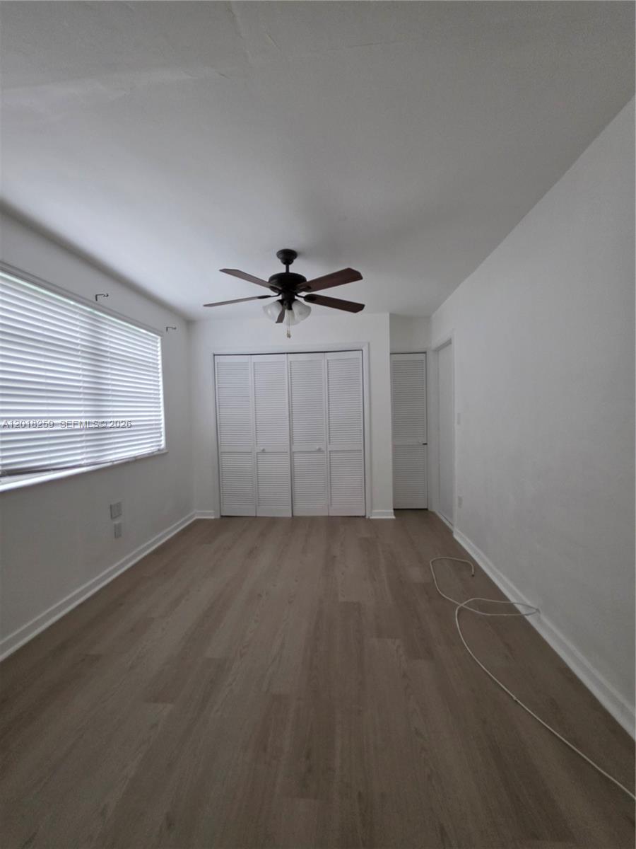 4601 Southwest 5th Street Miami, FL 33134 - Photo 23 of 23 a view of a livingroom with a ceiling fan and window