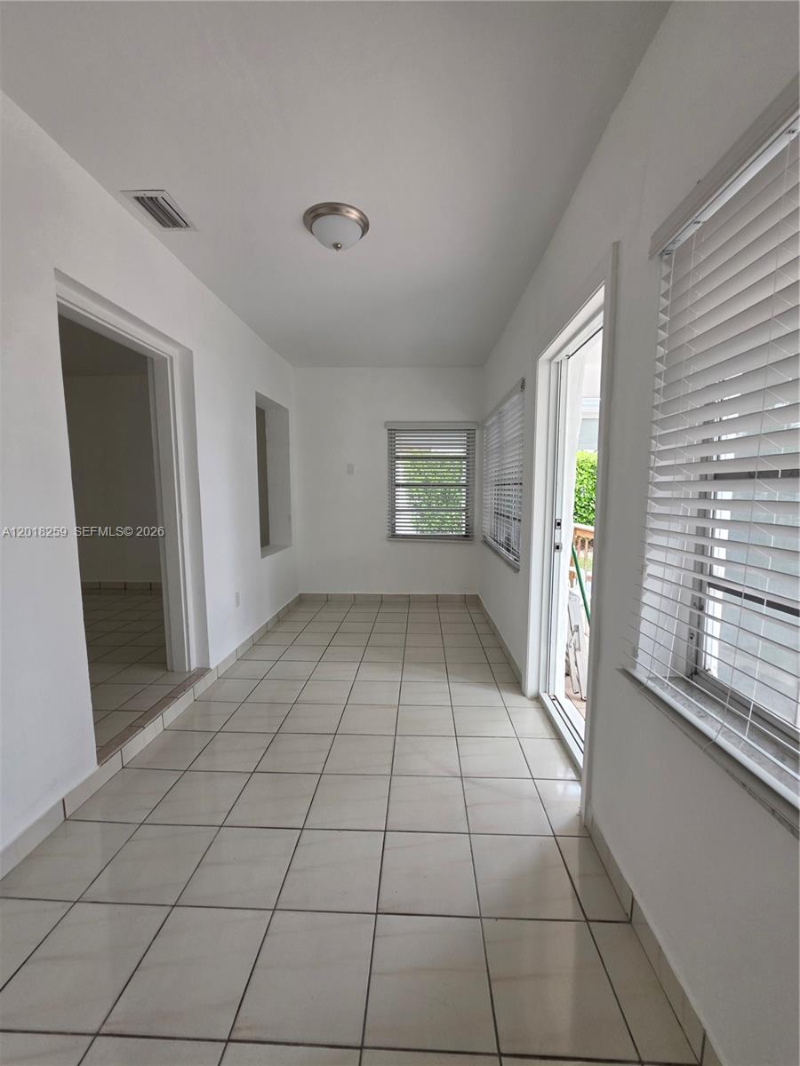 4601 Southwest 5th Street Miami, FL 33134 - Photo 10 of 23 a view of an empty room and window