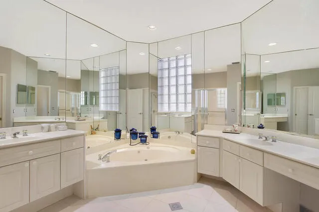a bathroom with a double vanity sink mirror double and mirrors