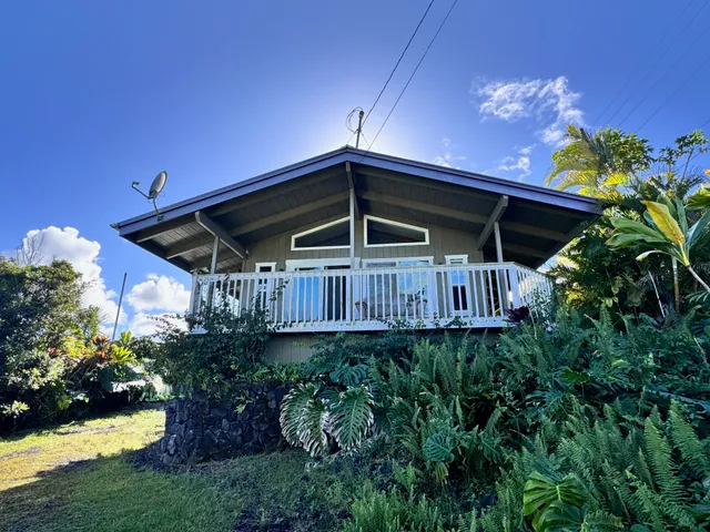 a view of a wooden deck with a yard