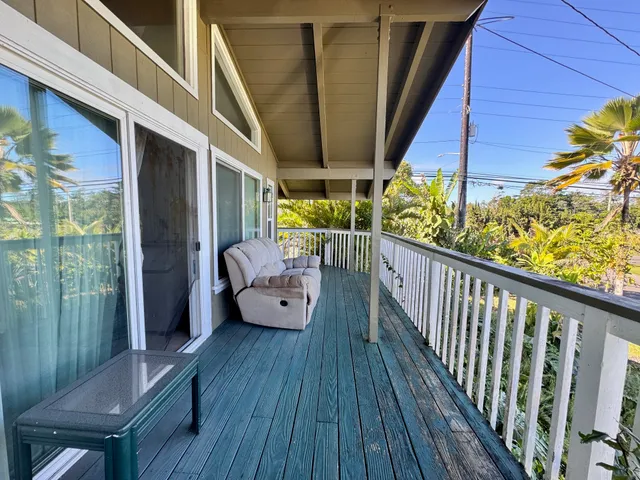 a view of balcony with furniture