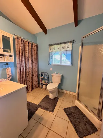 a bedroom with bed and window