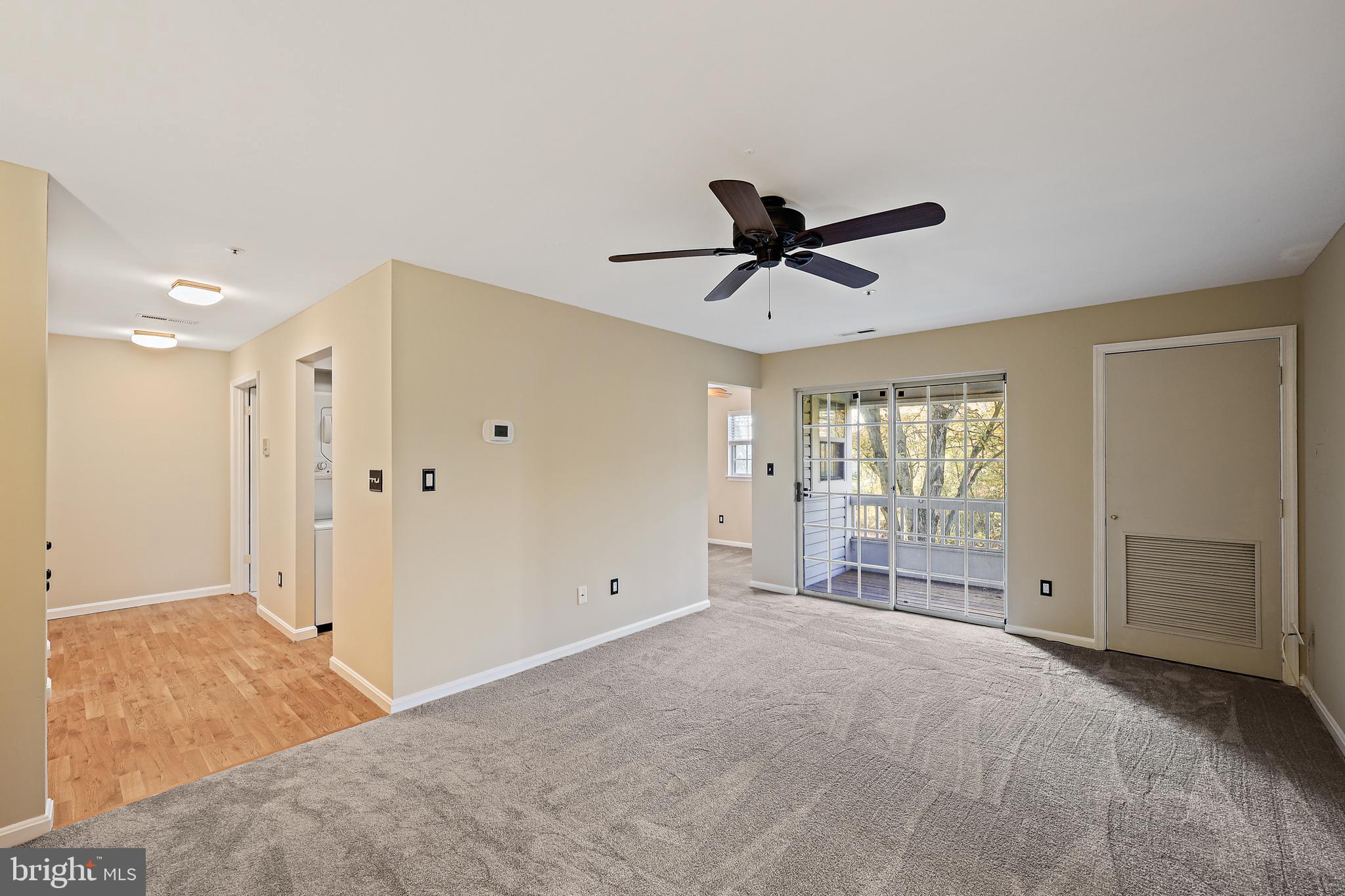 8358 Montgomery Run Road, Unit G Ellicott City, MD 21043 - Photo 12 of 38 Living room looking out at balcony