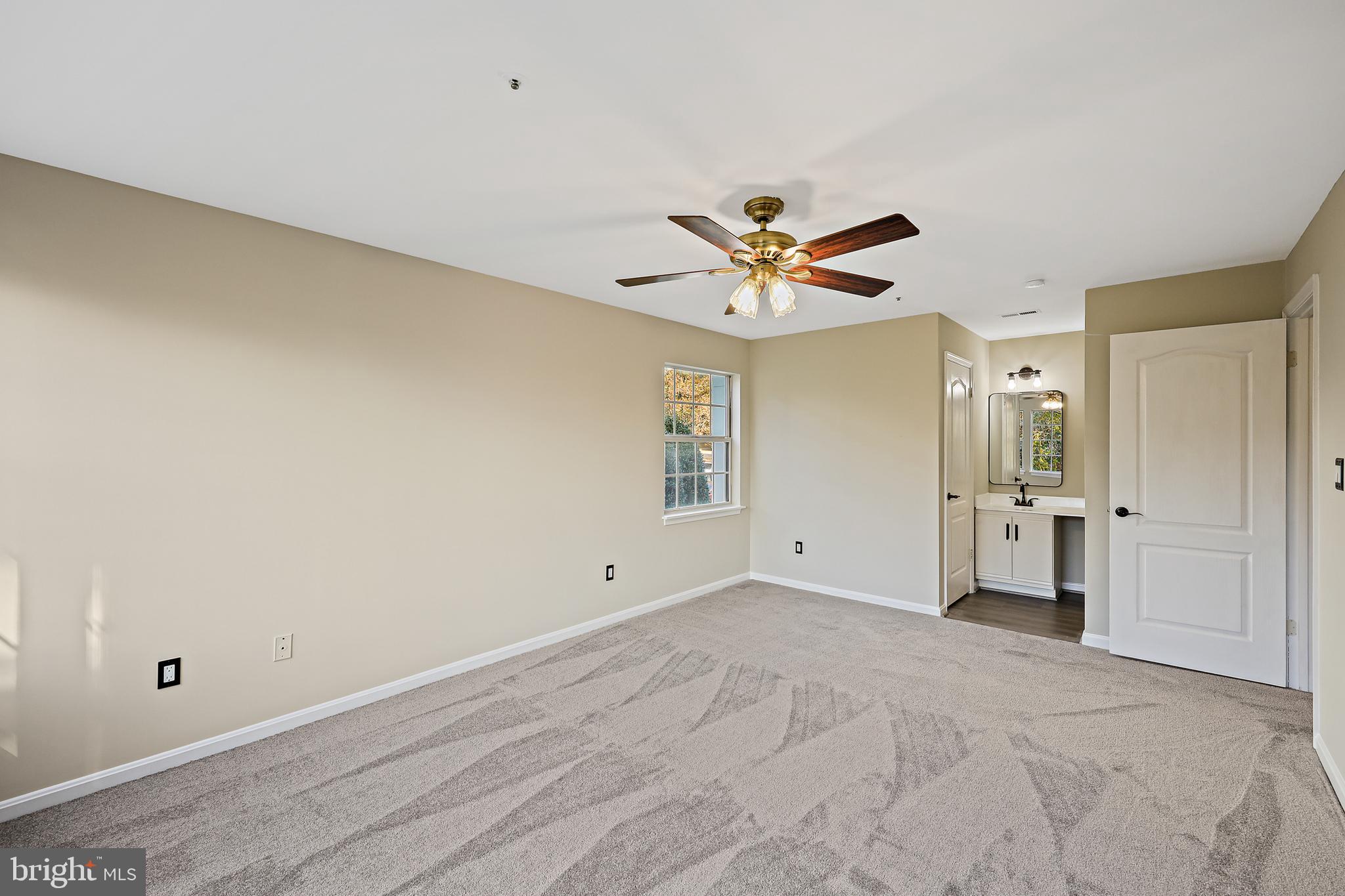8358 Montgomery Run Road, Unit G Ellicott City, MD 21043 - Photo 19 of 38 Primary bedroom looking into en-suite full bath