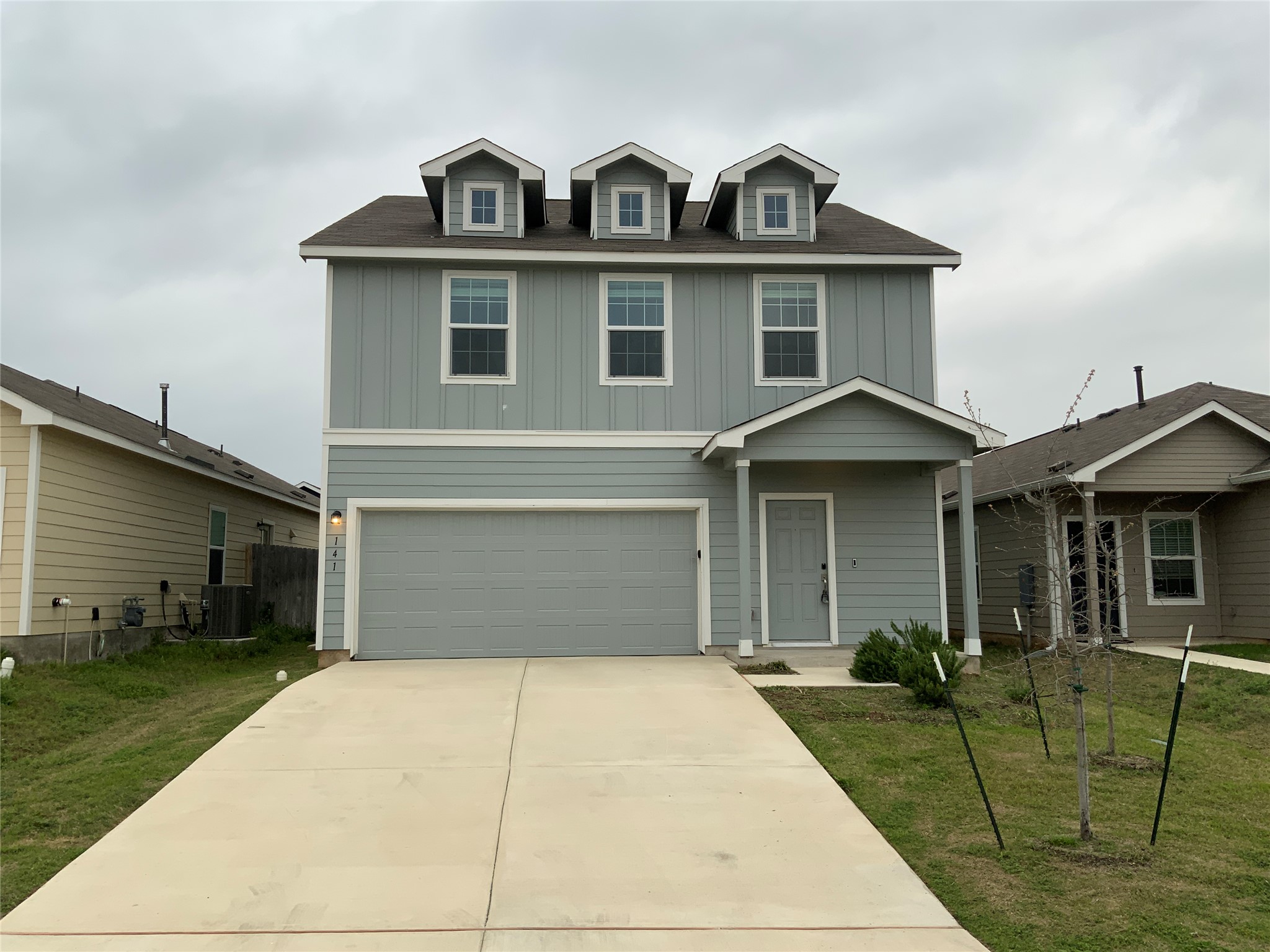 a front view of a house with a yard