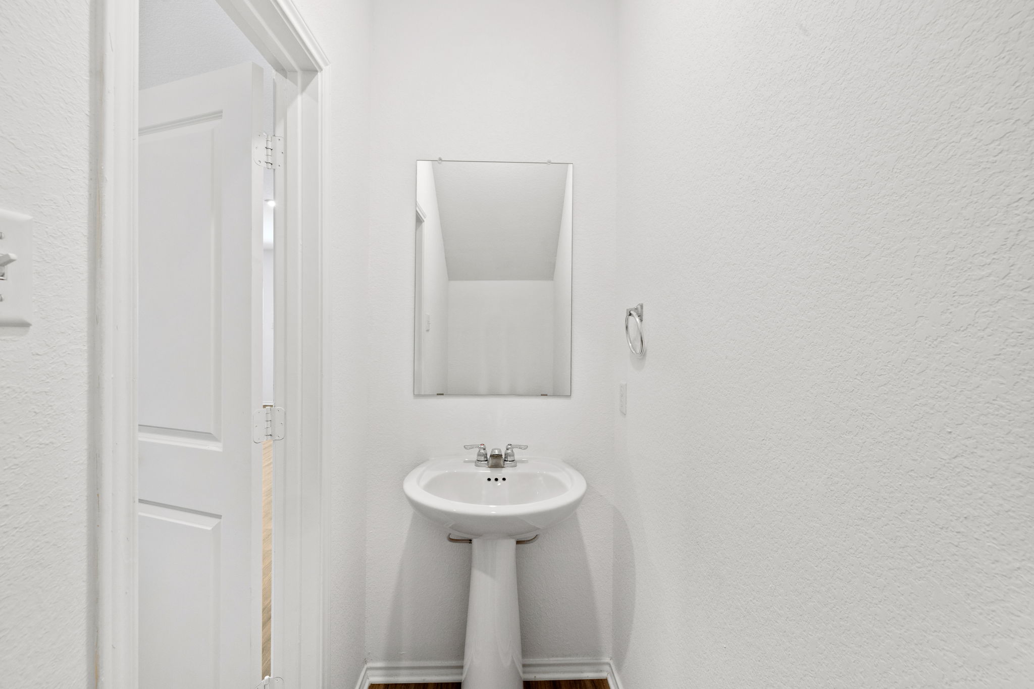 141 Mica Trail Maxwell, TX 78656 - Photo 4 of 30 a bathroom with a sink a mirror and a toilet