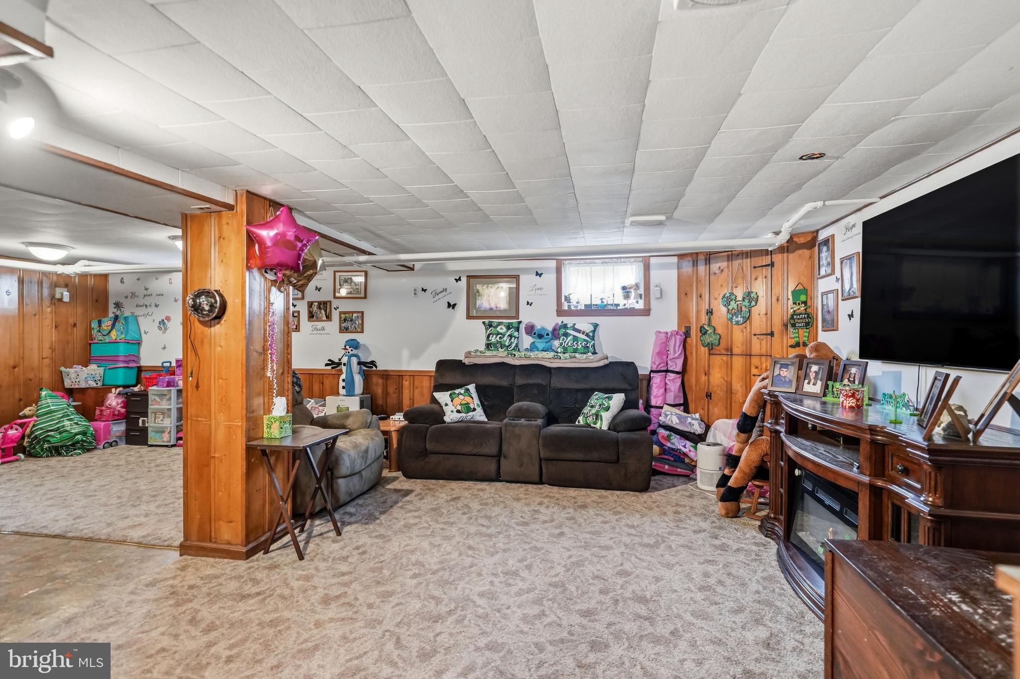 300 Delaware Avenue Riverside, NJ 08075 - Photo 34 of 86 a living room with lots of furniture and a flat screen tv