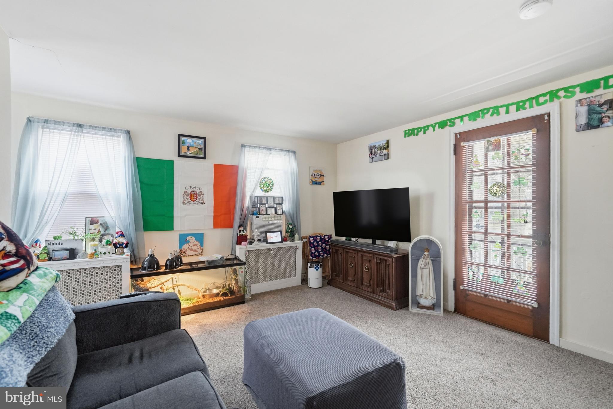 300 Delaware Avenue Riverside, NJ 08075 - Photo 77 of 86 a living room with furniture and a flat screen tv
