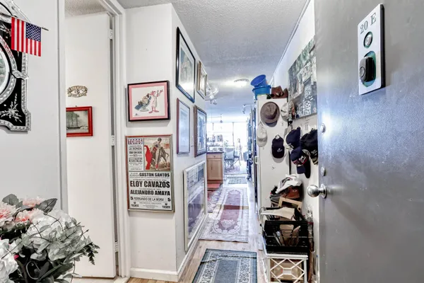 a view of a room with lots of stuff and hardwood floor