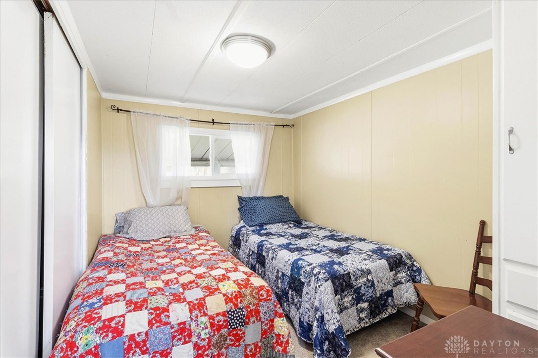 246 North Orchard Island Road Russells Point, OH 43348 - Photo 18 of 43 This cozy bedroom provides a comfortable and inviting retreat, perfect for restful nights.