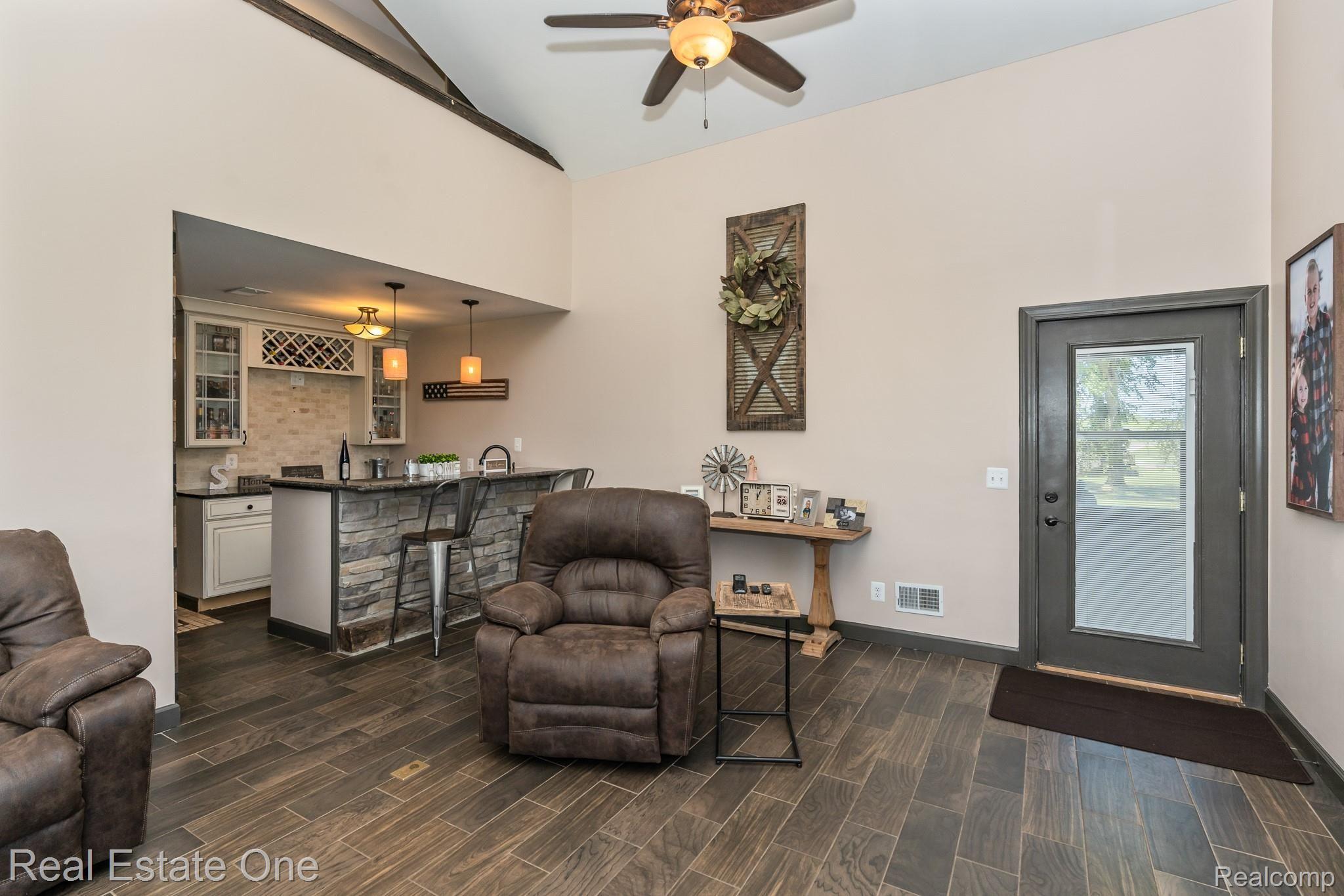 8047 Perry Road Grand Blanc, MI 48439 - Photo 33 of 48 Door leads out to the new 2019 patio or go up the stairs to the in-law suite.