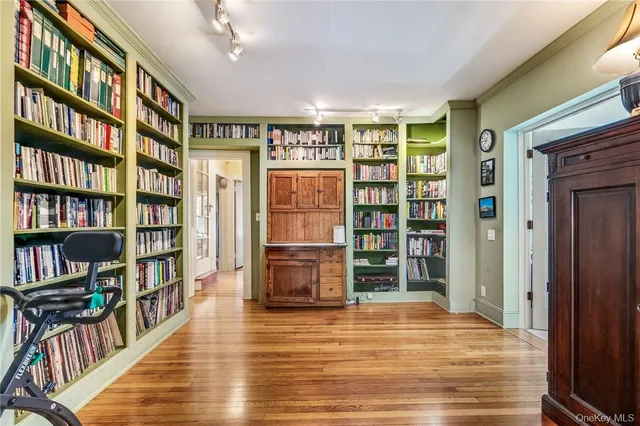 a view of a livingroom with furniture and staircase