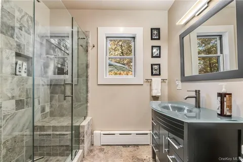 a bathroom with a sink and a mirror