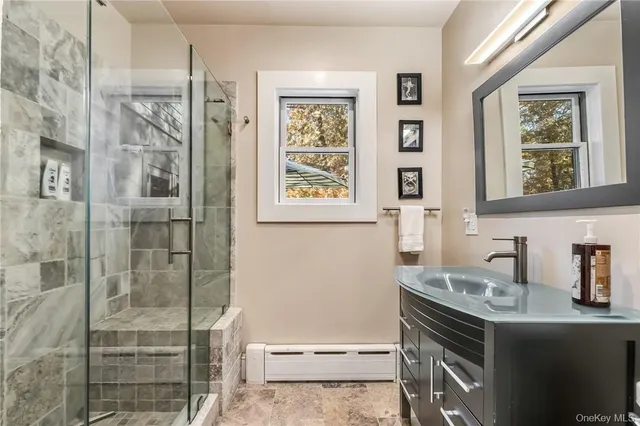 a bathroom with a sink and a mirror