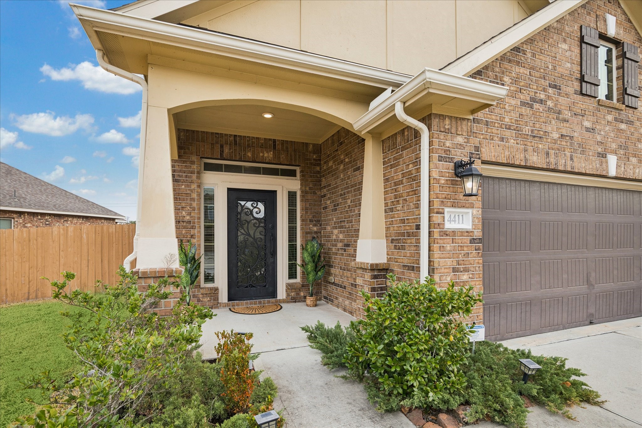 4411 Lone Alcove Drive Spring, TX 77386 - Photo 2 of 30 Step onto the covered front porch and into a welcoming entrance. Check out that steel door!