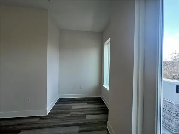 a kitchen with stainless steel appliances wooden cabinets stove and microwave
