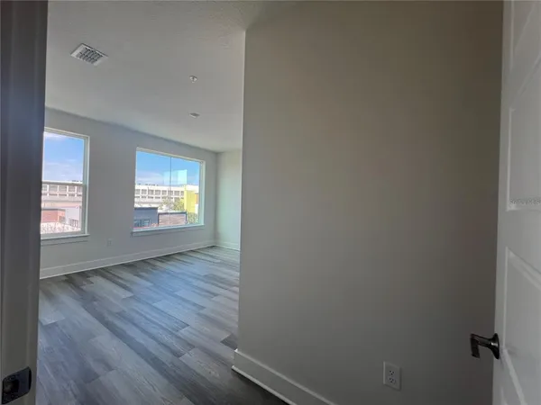 a bathroom with a toilet a sink a mirror a bathtub and vanity