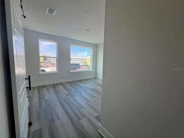 a bathroom with a toilet a sink a vanity and mirror