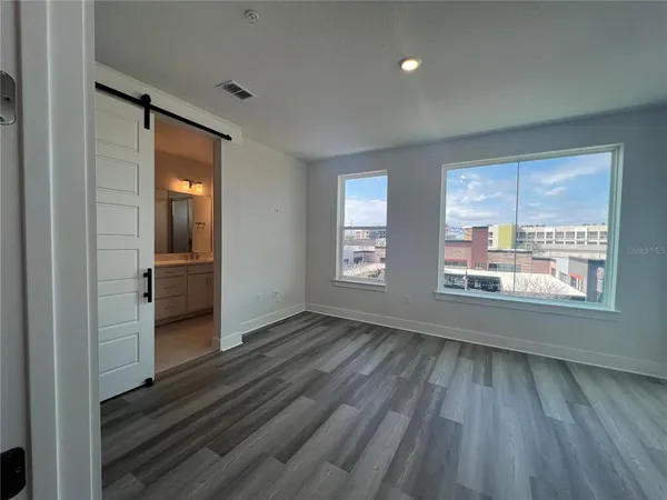 a view of a hallway with a door