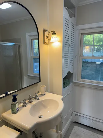a bathroom with a sink and a mirror