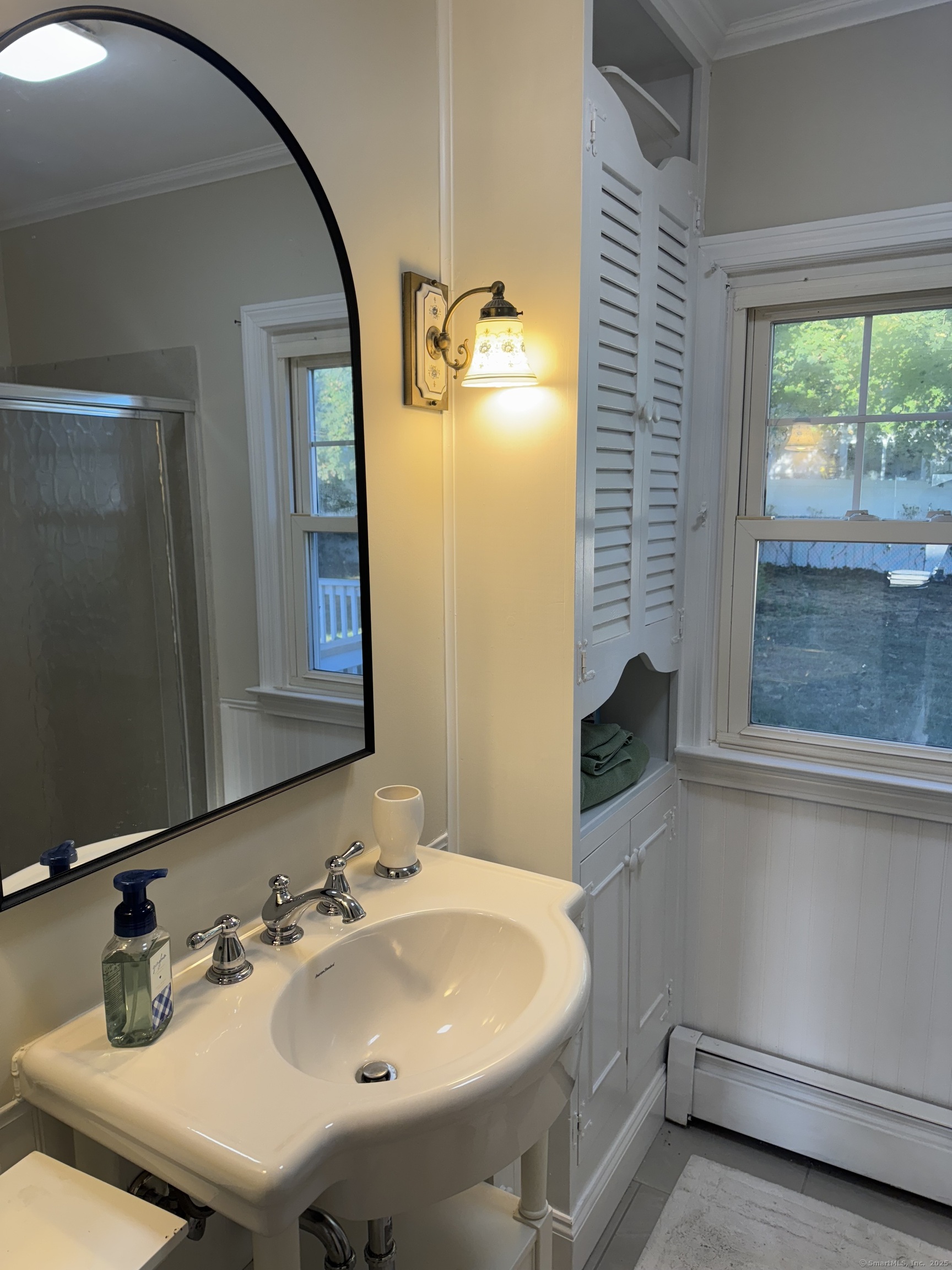 74 Uncas Road Clinton, CT 06413 - Photo 11 of 25 a bathroom with a sink and a mirror