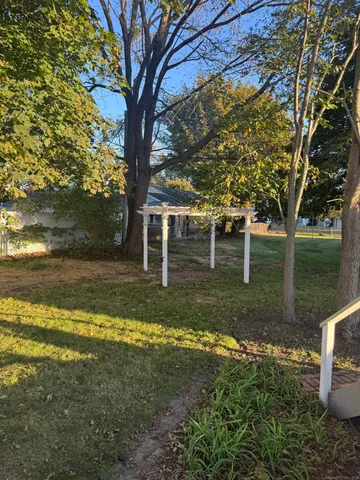 a view of backyard with green space