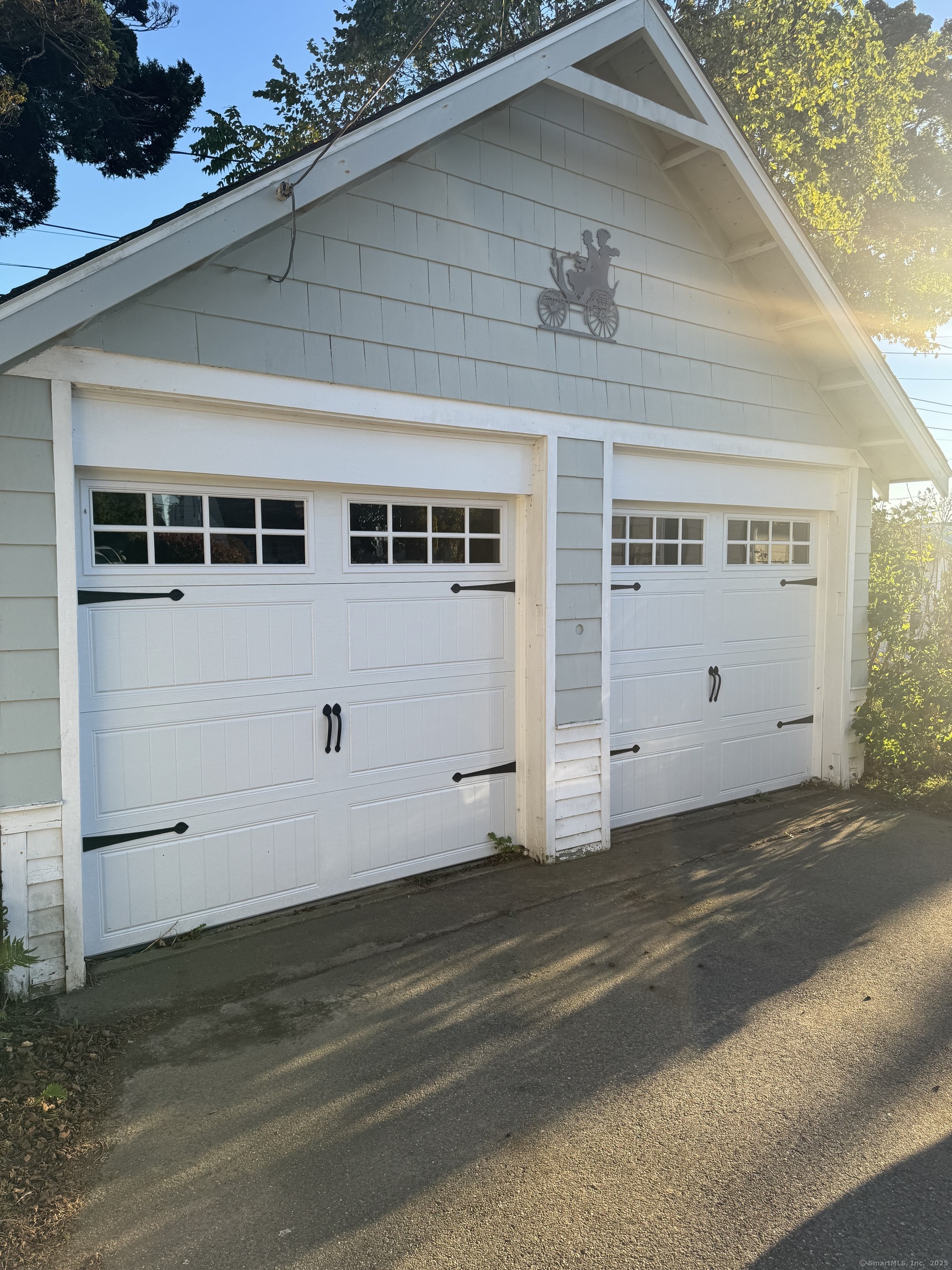 74 Uncas Road Clinton, CT 06413 - Photo 2 of 25 a view of a house with a garage