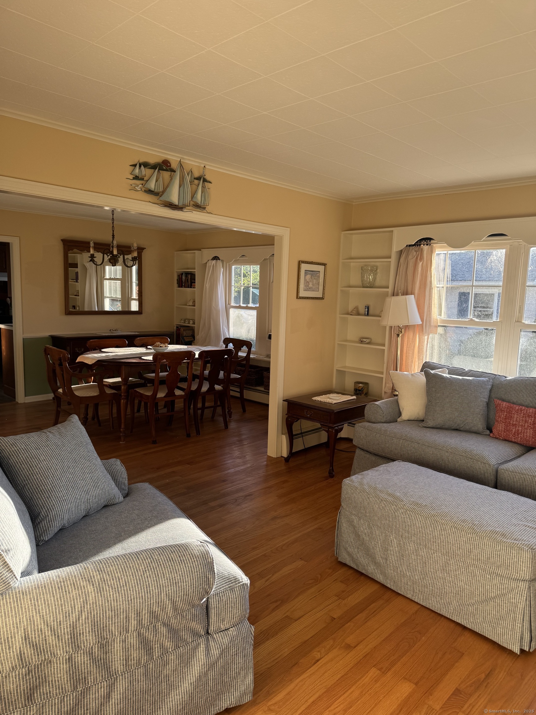 74 Uncas Road Clinton, CT 06413 - Photo 5 of 25 a living room with furniture window and wooden floor