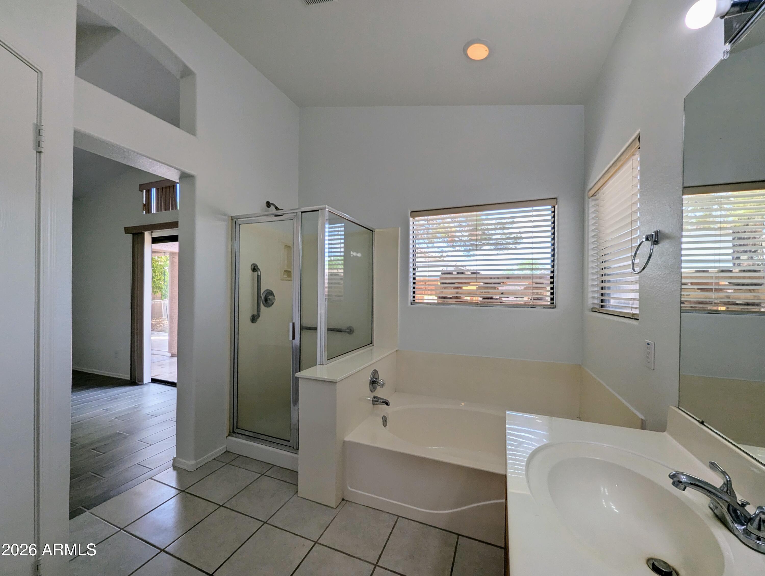 5424 West Wagoner Road Glendale, AZ 85308 - Photo 22 of 37 a bathroom with a bathtub and a sink