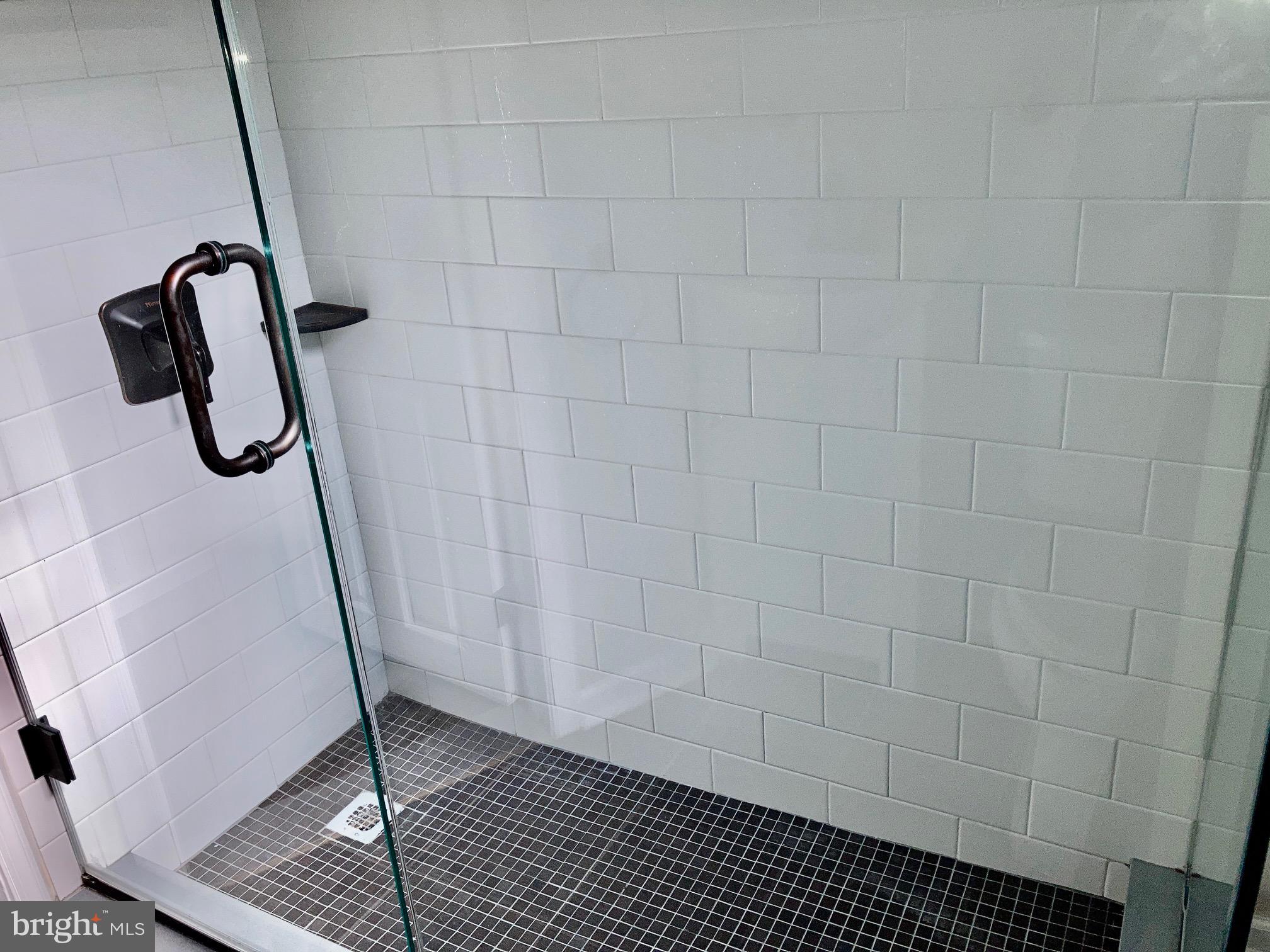 2647 South 12th Street Philadelphia, PA 19148 - Photo 15 of 19 a bathroom with a shower