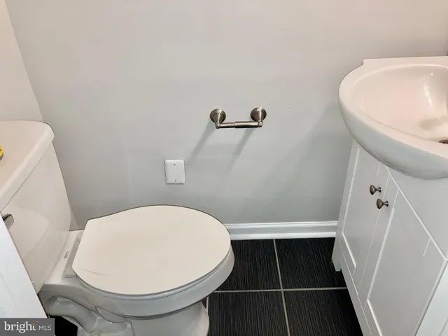 a bathroom with a toilet and a sink