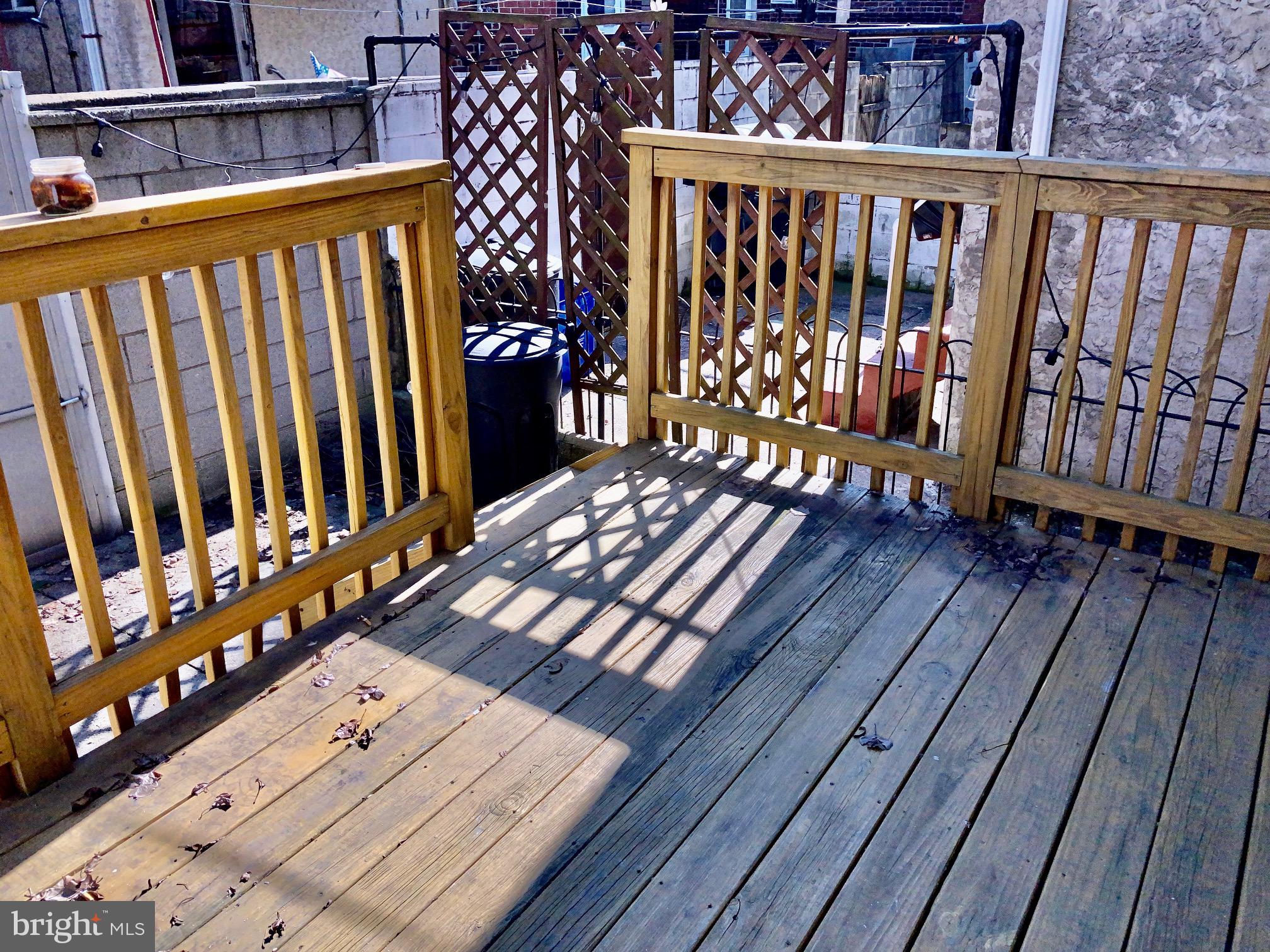 2647 South 12th Street Philadelphia, PA 19148 - Photo 17 of 19 a view of a wooden bench on the roof deck