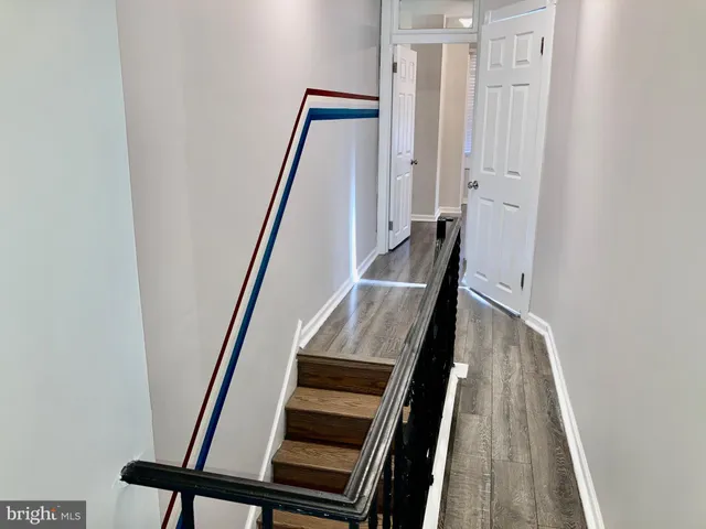 a view of an entryway with wooden floor